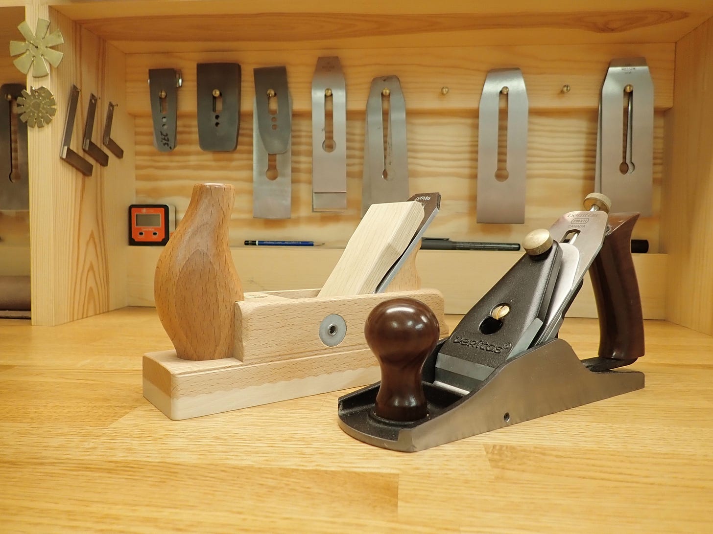 Wooden plane next to Veritas custom #4 Wooden plane next to Veritas custom #4