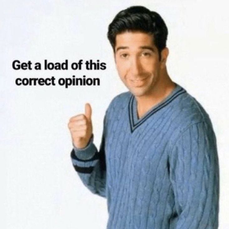 This may contain: a man in a blue sweater is giving the thumbs up and saying get a load of this correct opinion