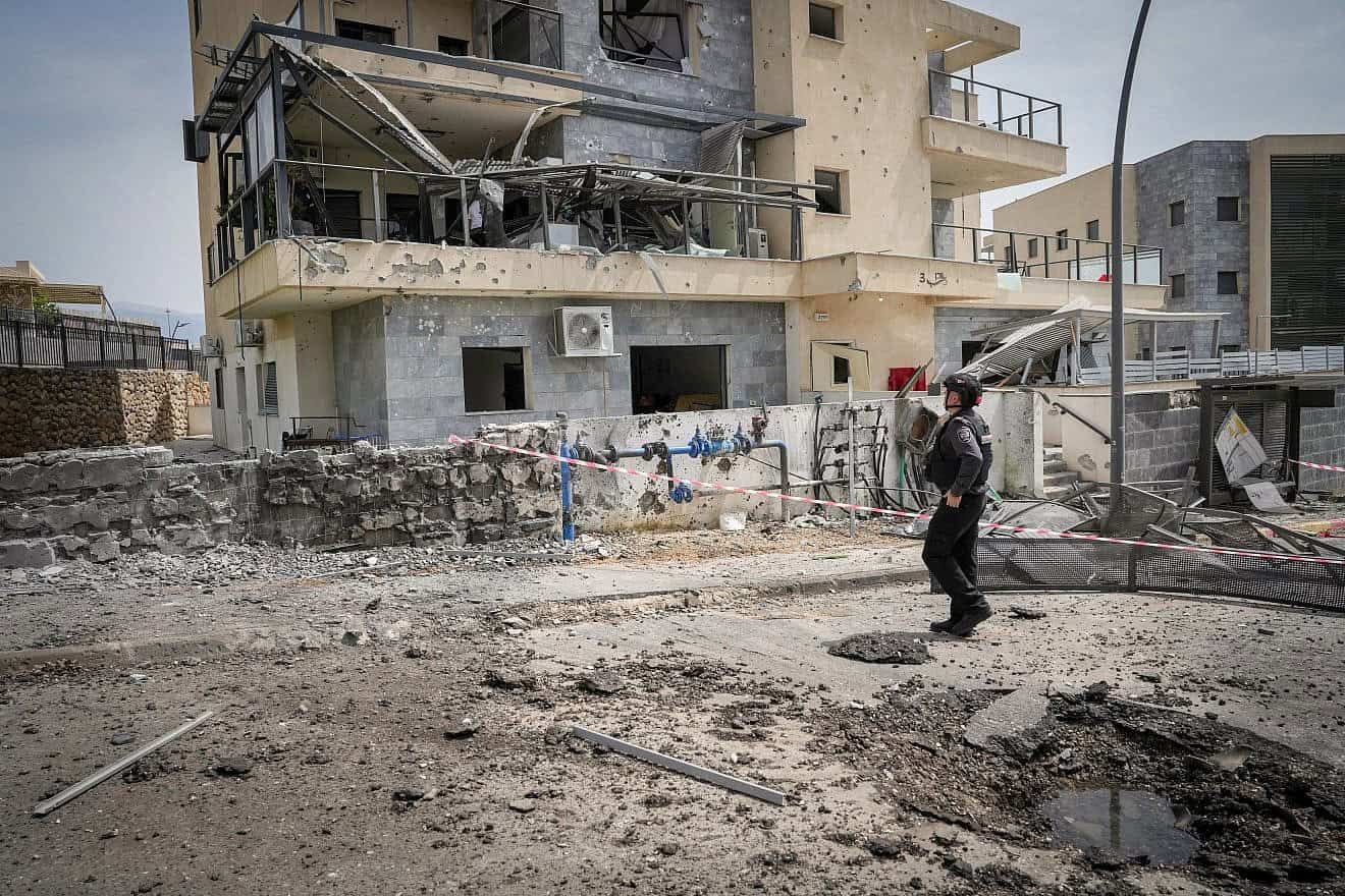 An Israeli solder views the damage after a rocket fired by Hezbollah in Lebanon hit the Galilee city of Kiryat Shmona, March 27, 2024. Photo by Ayal Margolin/Flash90. An Israeli solder views the damage after a rocket fired by Hezbollah in Lebanon hit the Galilee city of Kiryat Shmona, March 27, 2024. Photo by Ayal Margolin/Flash90.