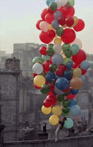 A bunch of balloons carry a boy into the sky A bunch of balloons carry a boy into the sky