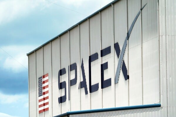 A SpaceX logo is displayed on a building, May 26, 2020, at the Kennedy Space Center in Cape Canaveral, Fla. (AP Photo/David J. Phillip, File) A SpaceX logo is displayed on a building, May 26, 2020, at the Kennedy Space Center in Cape Canaveral, Fla. (AP Photo/David J. Phillip, File)