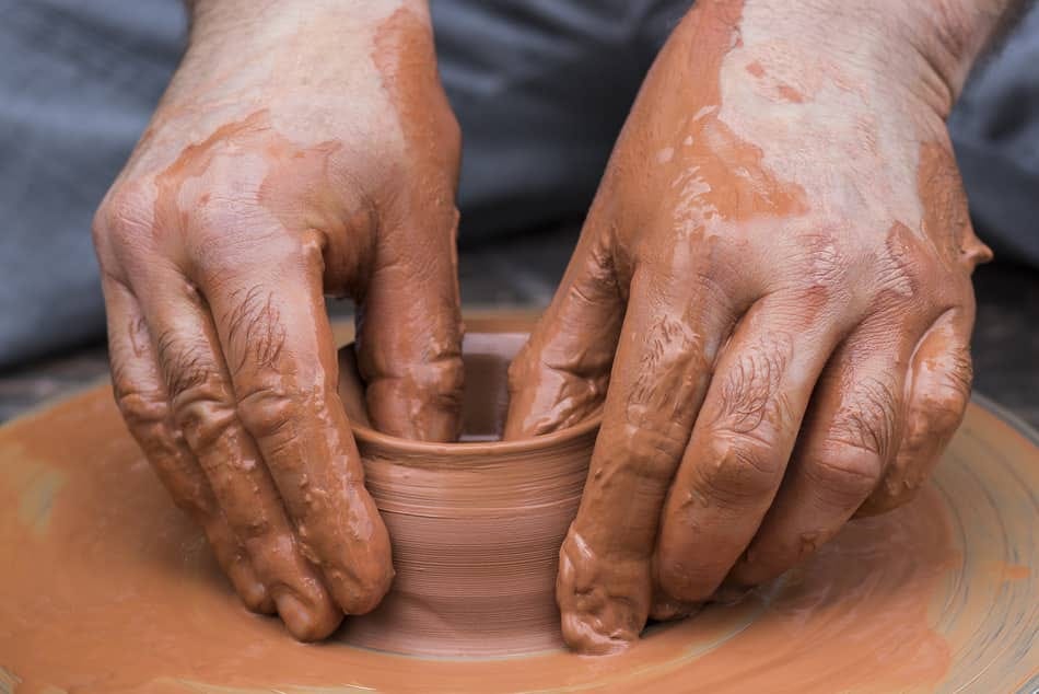 Hands shaping clay on a potter’s wheel, illustrating how daily choices under pressure form a believer’s character. Hands shaping clay on a potter’s wheel, illustrating how daily choices under pressure form a believer’s character.