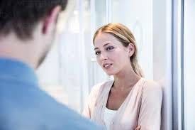 Man and woman talking stock photo
