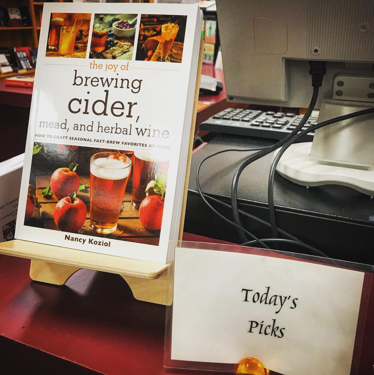 Cover of "The Joy of Brewing Cider, Mead, and Herbal Wine" by Nancy Koziol on display at the Bennington Bookshop, labeled “Today’s Picks.”