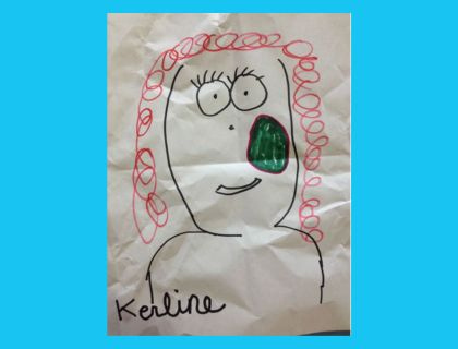 child's drawing of curly haired person with green growth on their cheek