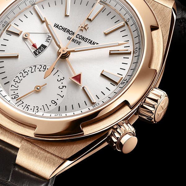 Both red-tipped hands stay synchronized to your home time. Both red-tipped hands stay synchronized to your home time.