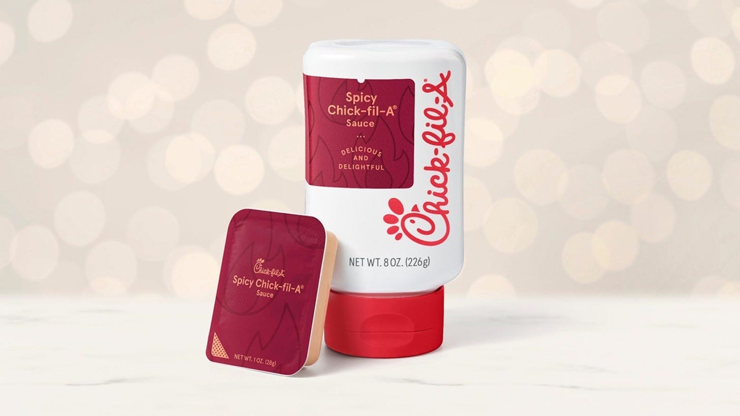 Spicy Chick-fil-A Sauce in a dipping cup and an 8-ounce bottle. Image: Chick-fil-A Spicy Chick-fil-A Sauce in a dipping cup and an 8-ounce bottle. Image: Chick-fil-A