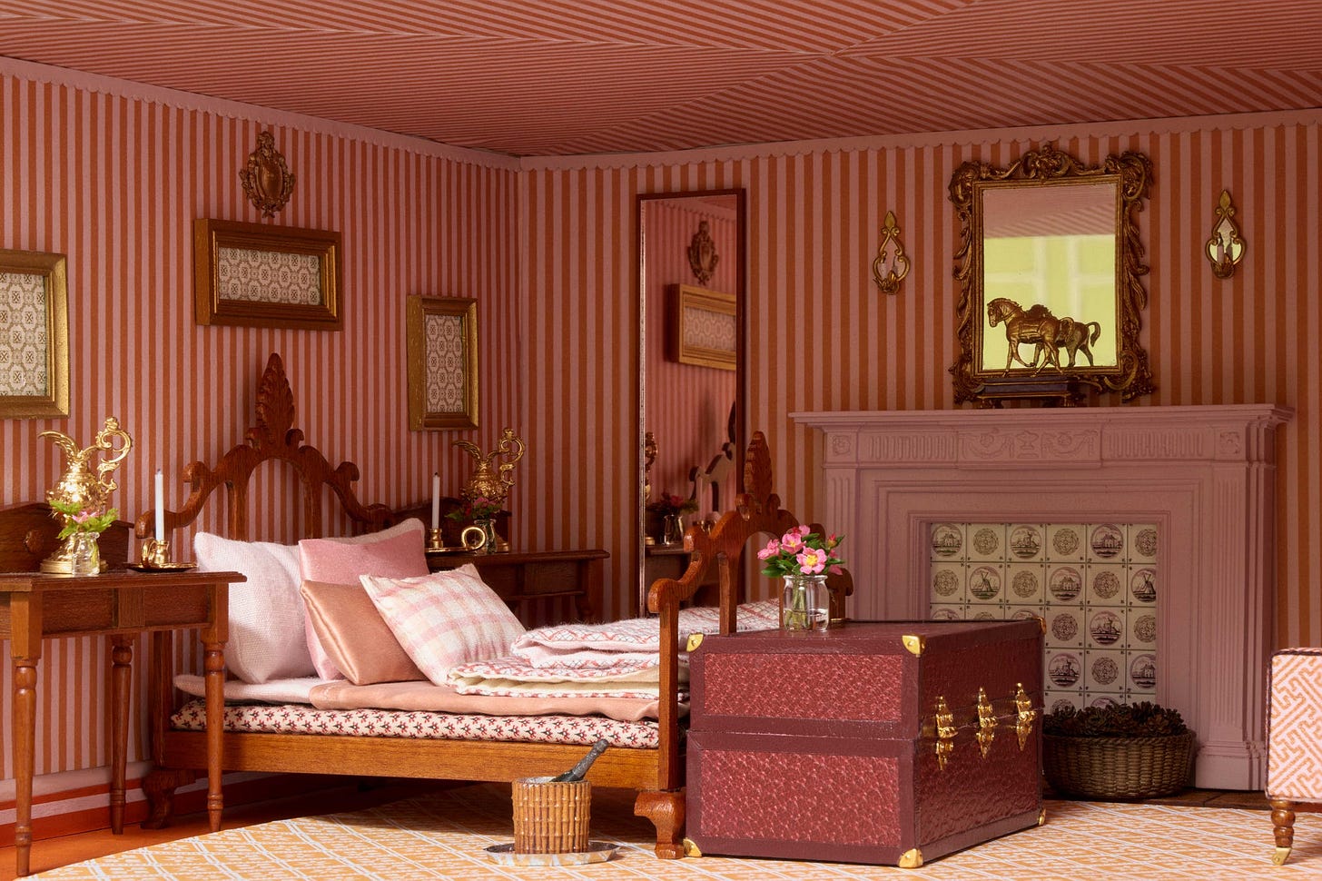 Stylish bedroom with striped walls, a wooden bed, decorative pillows, a fireplace, and a vintage trunk. Stylish bedroom with striped walls, a wooden bed, decorative pillows, a fireplace, and a vintage trunk.