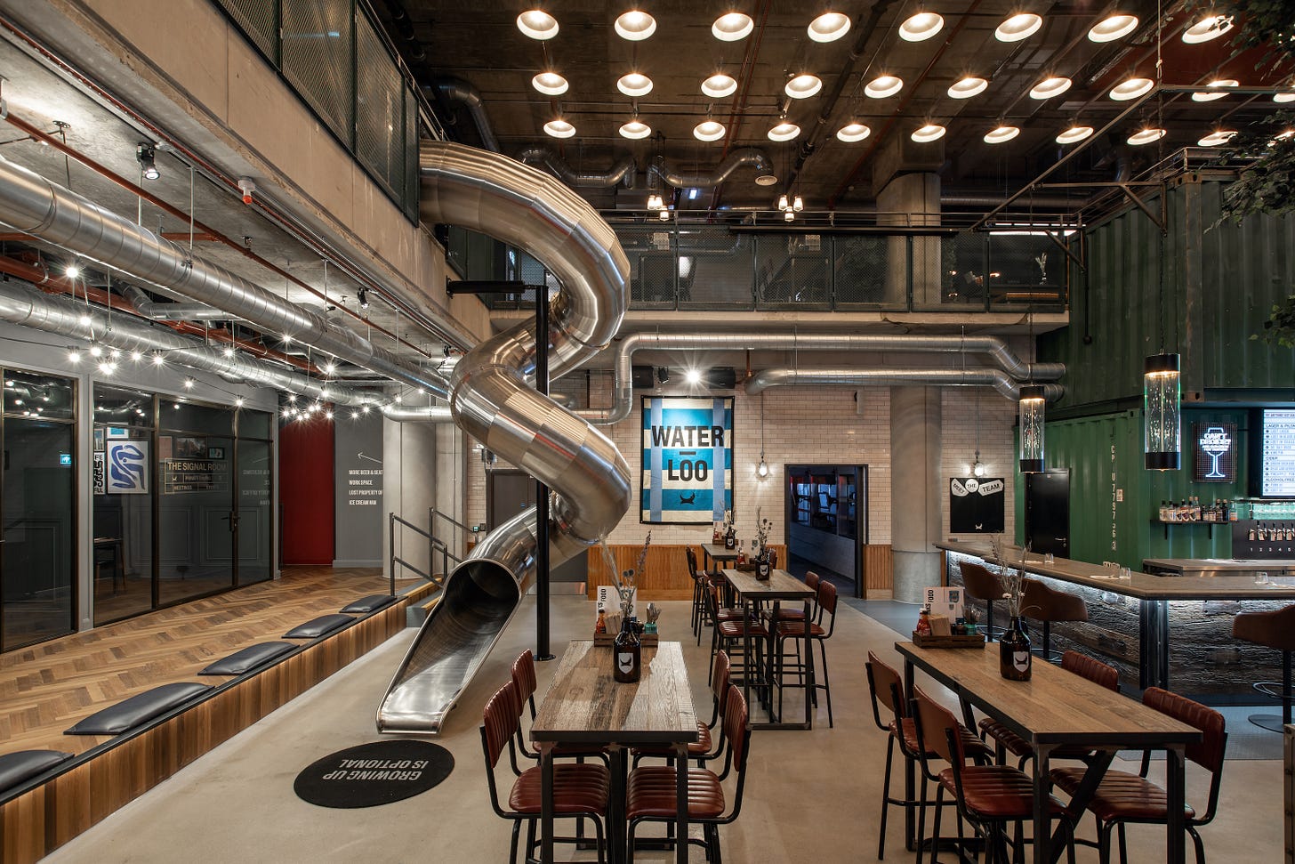 The interior of Brewdog Waterloo, featuring a metal slide.