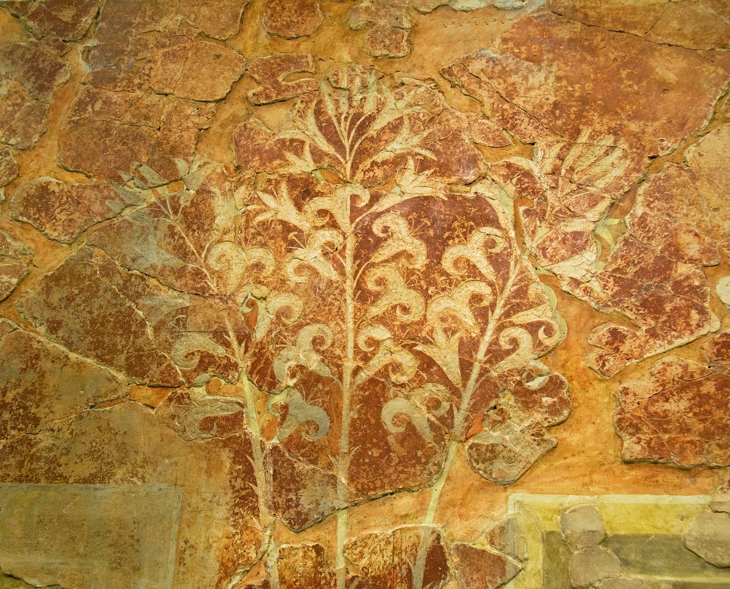 Three vertical stems covered in full-open and partly-open lily flowers and topped with clusters of lily buds. The stems and the flowers are all solid white on a dark red background.