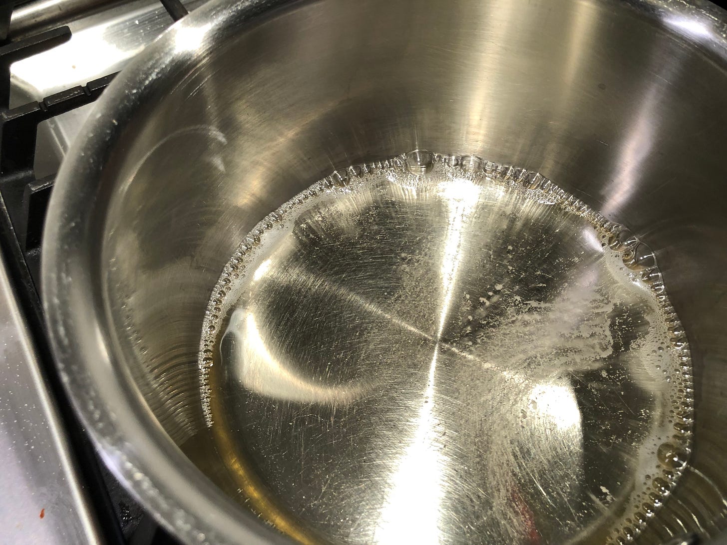 White whine simmering in a small saucepan