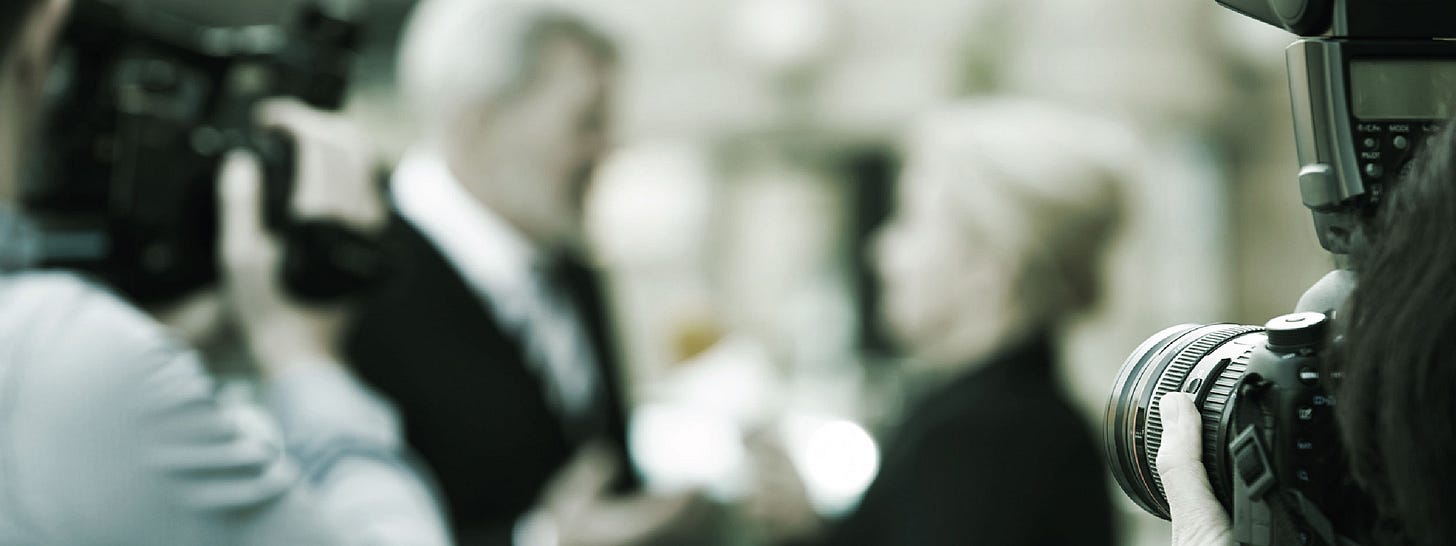 Media scrum with cameras