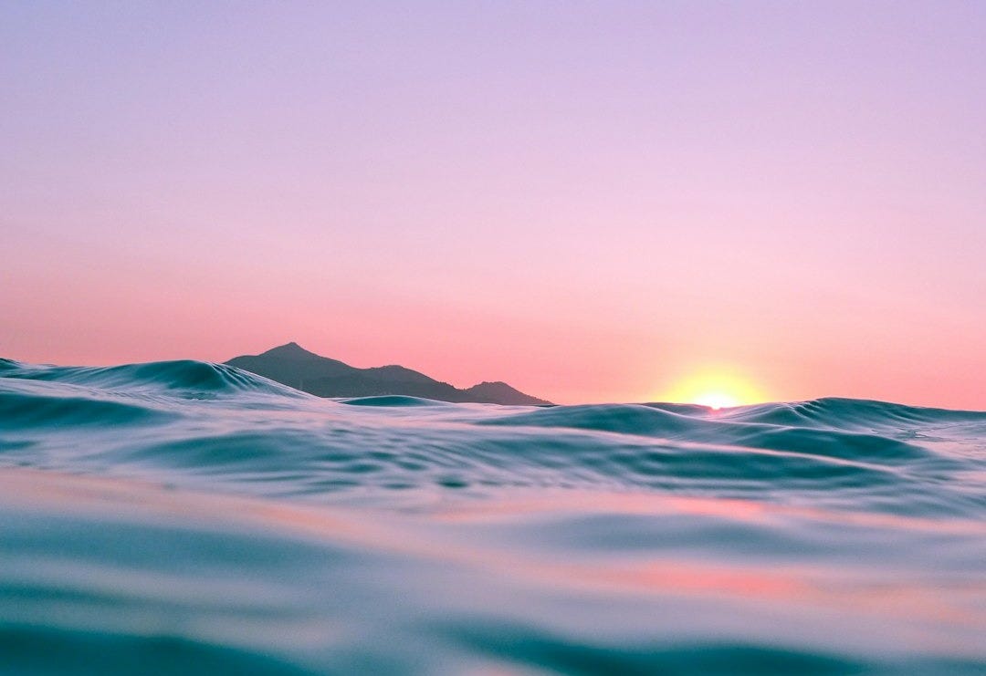 calm body of water during golden hour