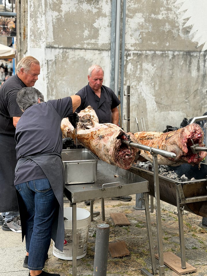 Early afternoon crowds of Festas de São João, and a picture of some men roasting pork