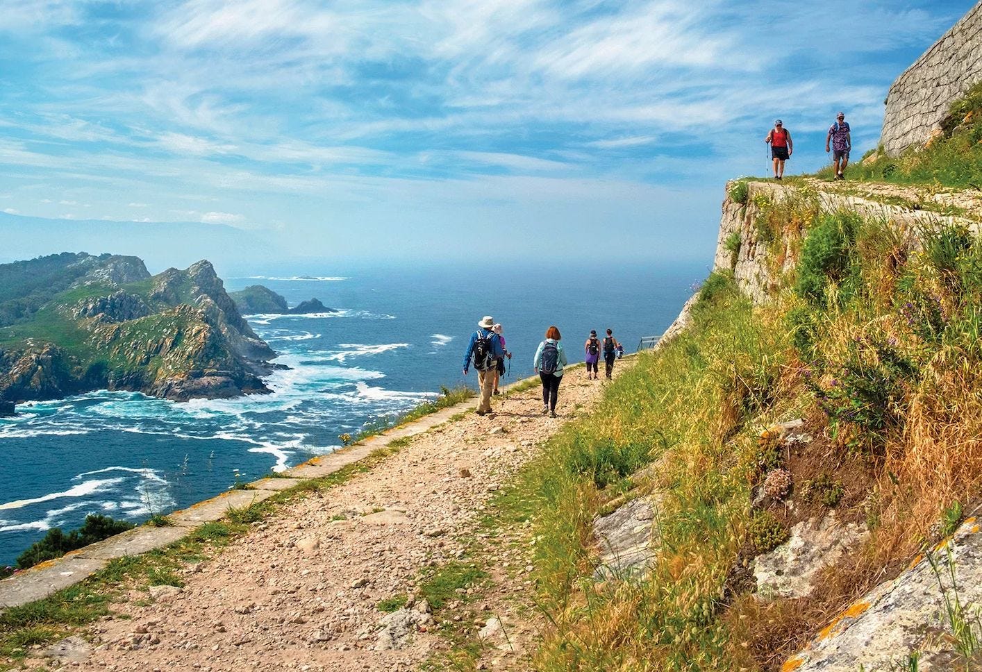 Pilgrims walking along the Portuguese Camino on their way to Santiago de Compostela. Pilgrims walking along the Portuguese Camino on their way to Santiago de Compostela.