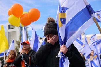 Israelis in Hostages Square as the bodies of Oded Lifshitz and Shiri, Ariel and Kfir Bibas are brought from Gaza to Israel