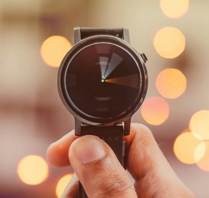 round silver-colored smartwatch bokeh photography round silver-colored smartwatch bokeh photography