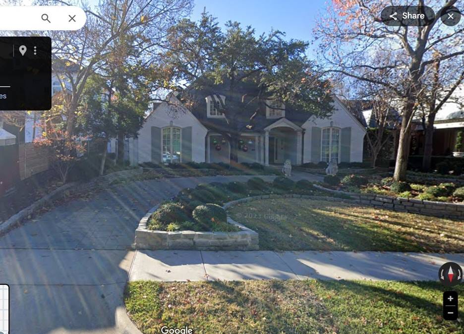 A house with a driveway and trees

AI-generated content may be incorrect.