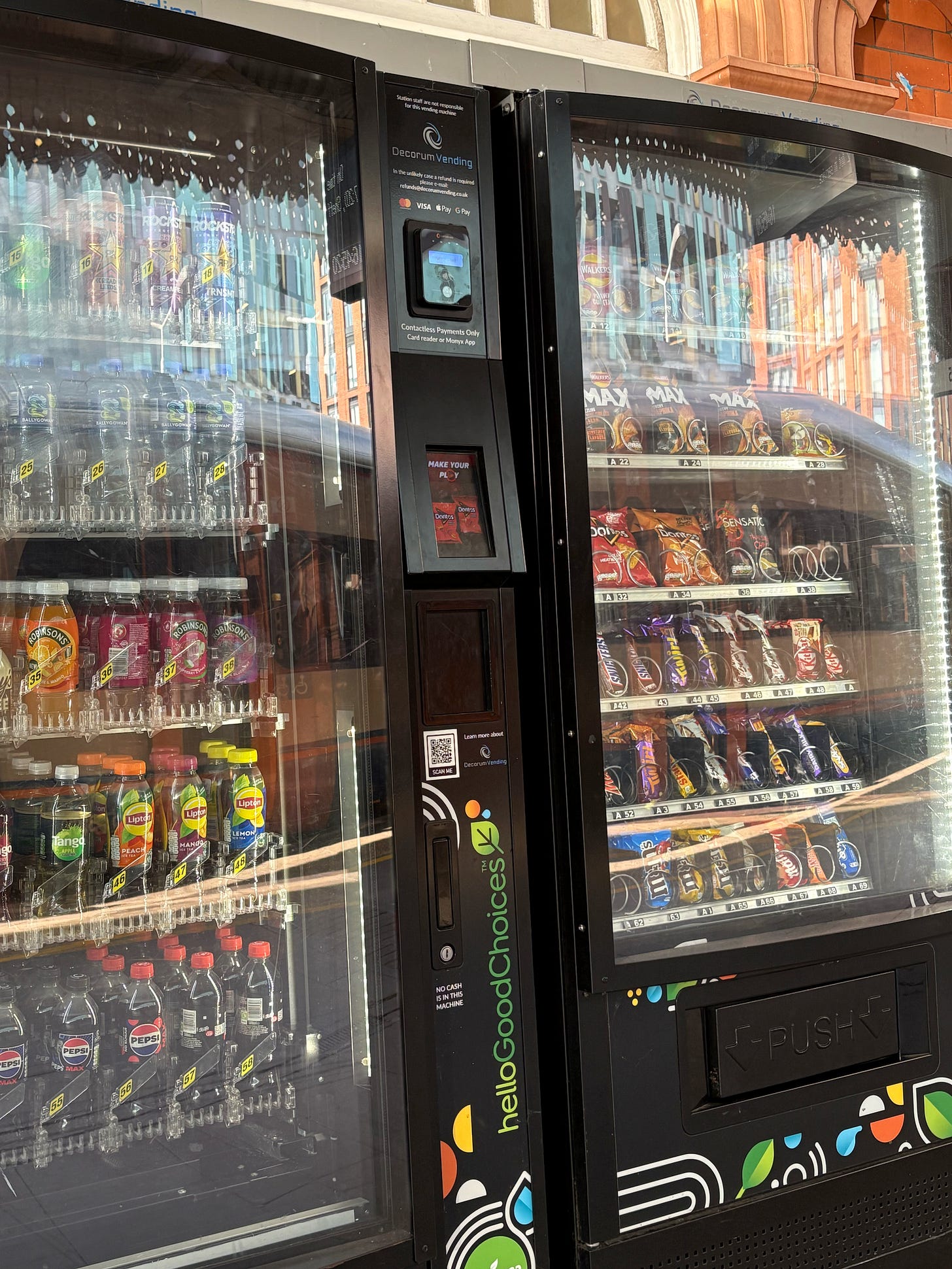Two vending machines with the contactless payment facilities at the top of the machine