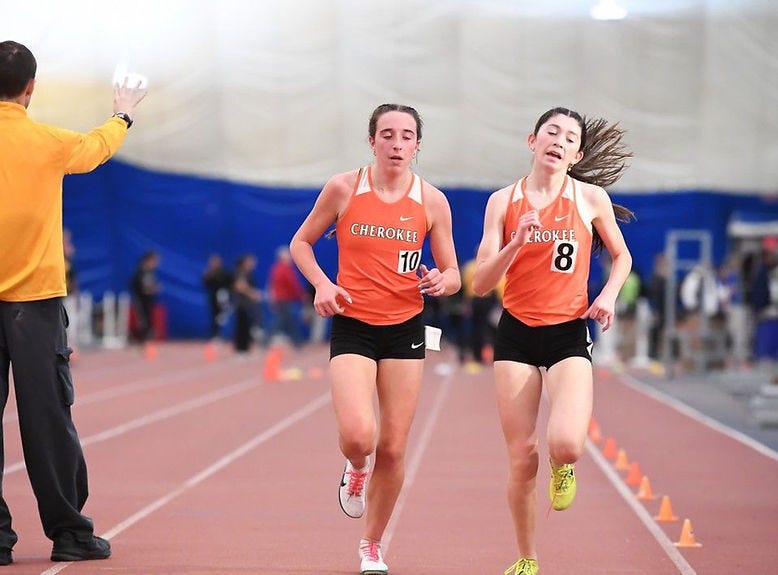 Meder and Healy heading into the last lap of the 3200m.