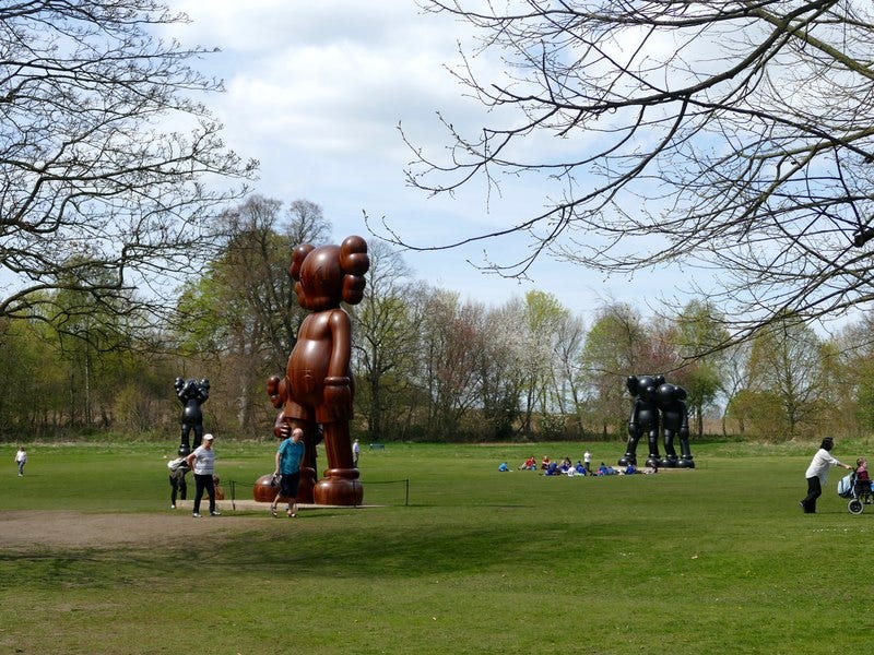 KAWS figures at Yorkshire Sculpture Park, England. KAWS figures at Yorkshire Sculpture Park, England.