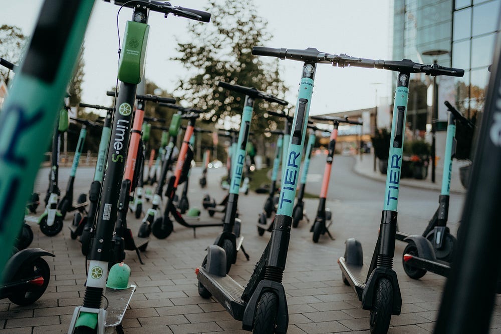 Photo of e-scooters in the city street Photo of e-scooters in the city street