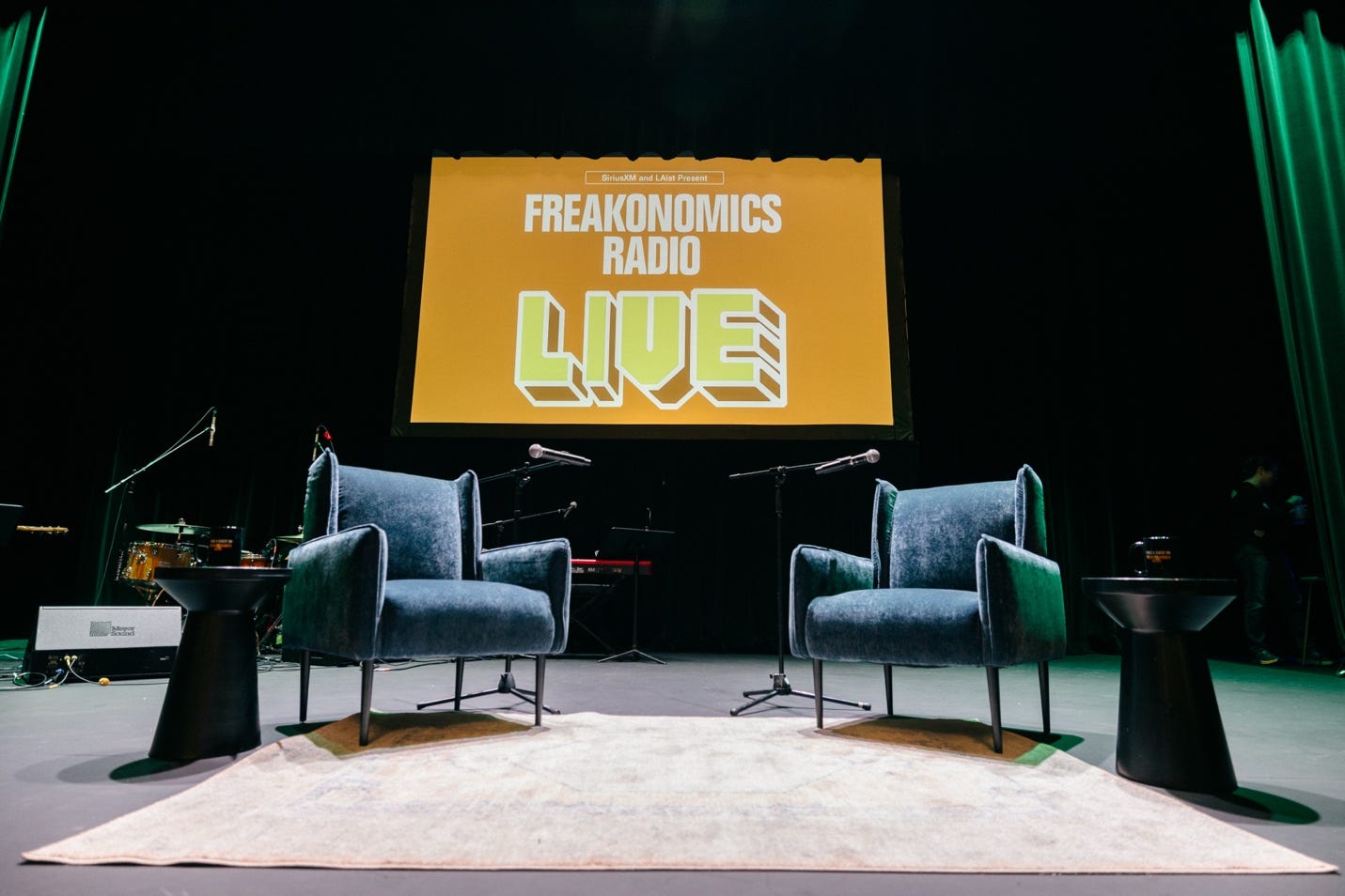 A stage with chairs and microphones

Description automatically generated