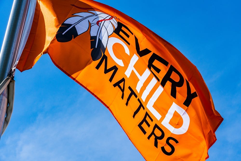 An orange Every Child Matters flag. An orange Every Child Matters flag.