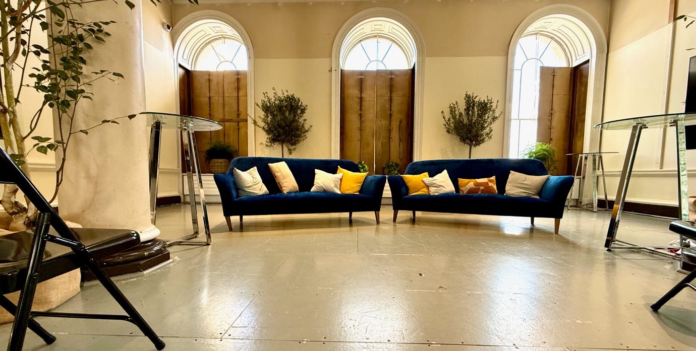 A room with two couches and a table

AI-generated content may be incorrect.