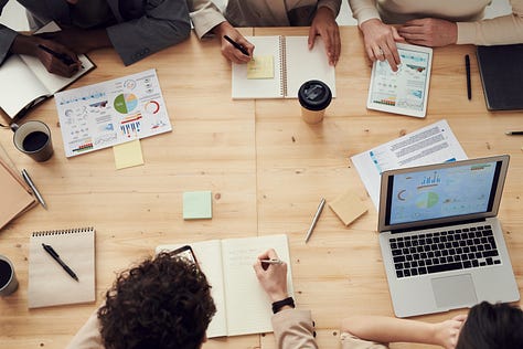 a person or a team brainstorming marketing ideas