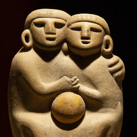 sculptures of people hugging