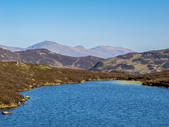 View to Ben Lawers from and picnicking at the ‘infinity loch’ – Lochan Mhaoil na Meidhe – within the proposed turbine site © Felicity Martin