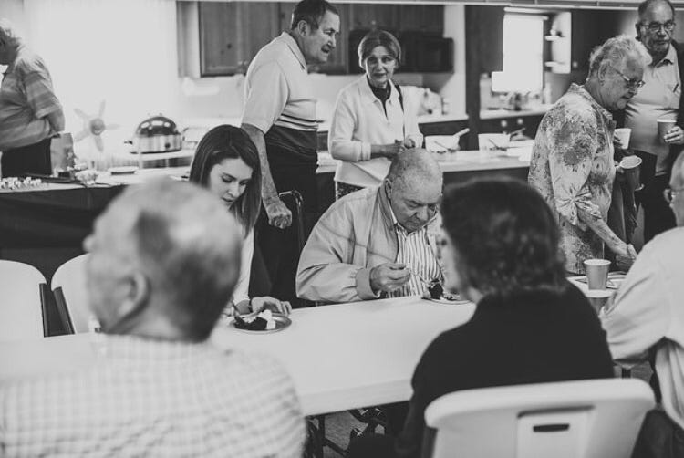 woman eating cake with her grandpa