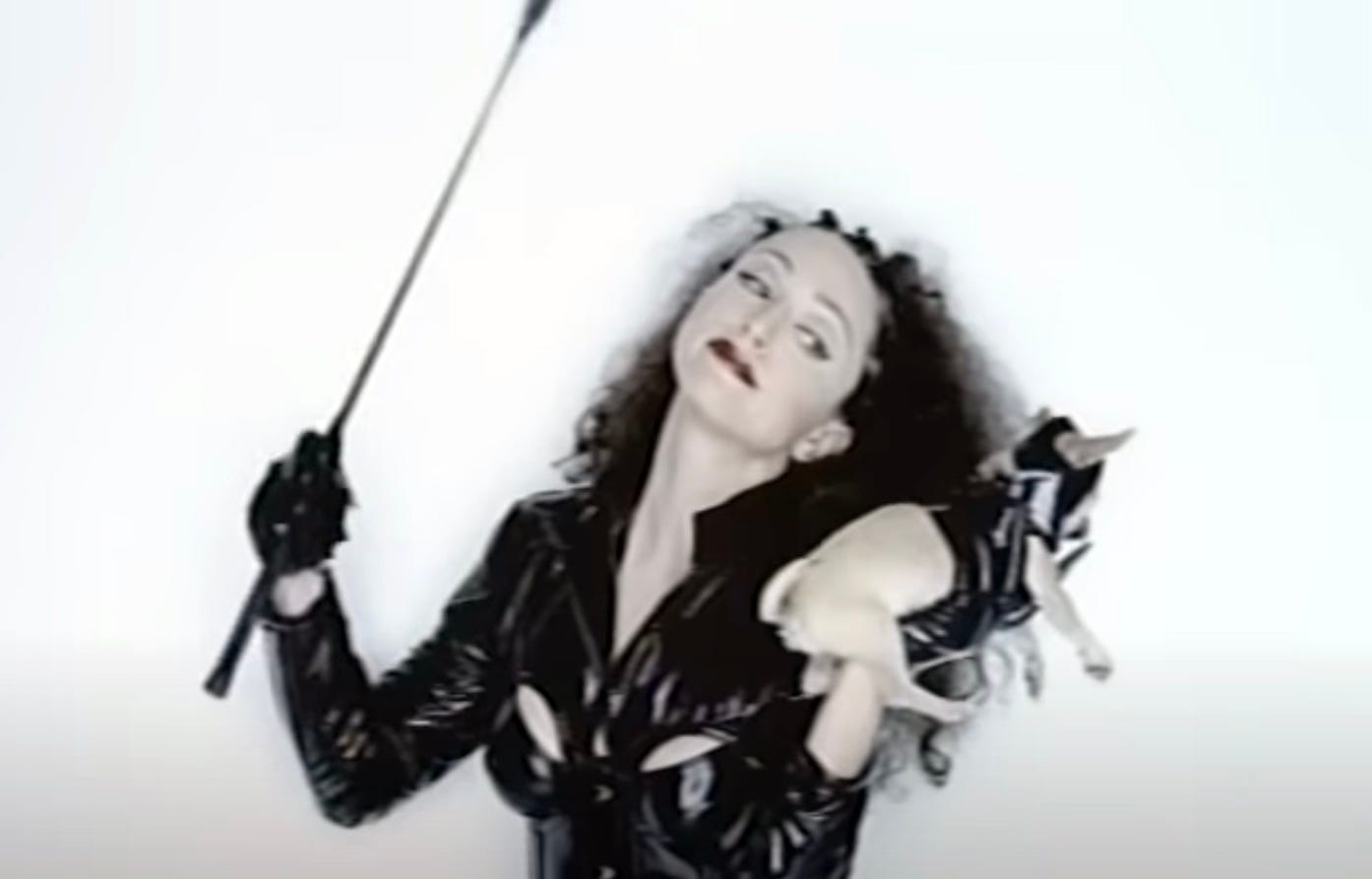Madonna in Human Nature video pretending to spank a chihuahua