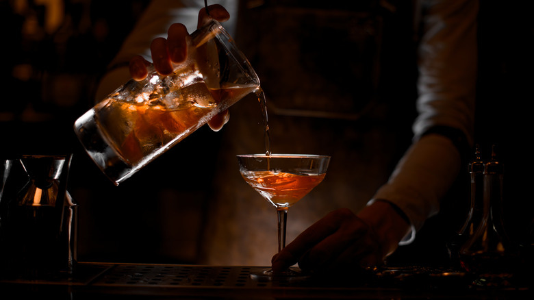 Bartender mixing cocktail
