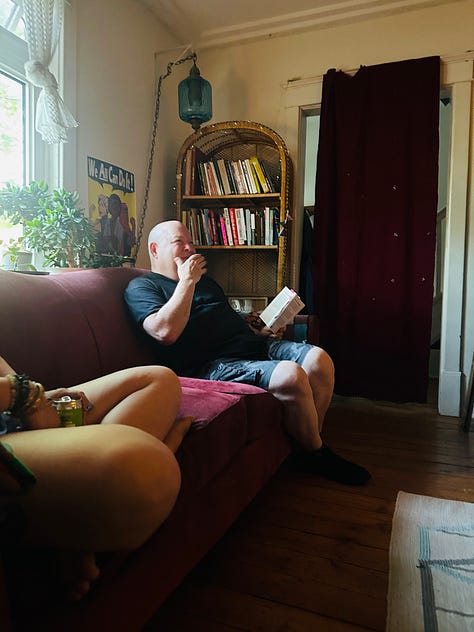 Photo 1: A group of poets/friends on a terrace in Old Montreal. Photo 2: A flier of Kirby's reading for She on a screen door in Kingston ON Photo 3: Kirby reading in a living room.