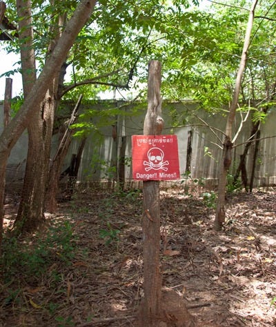 Unexploded devices warning at the Land Mind Museum in Cambodiae at the Land Mine Museum, Battambang, Cambodia Unexploded devices warning at the Land Mind Museum in Cambodiae at the Land Mine Museum, Battambang, Cambodia