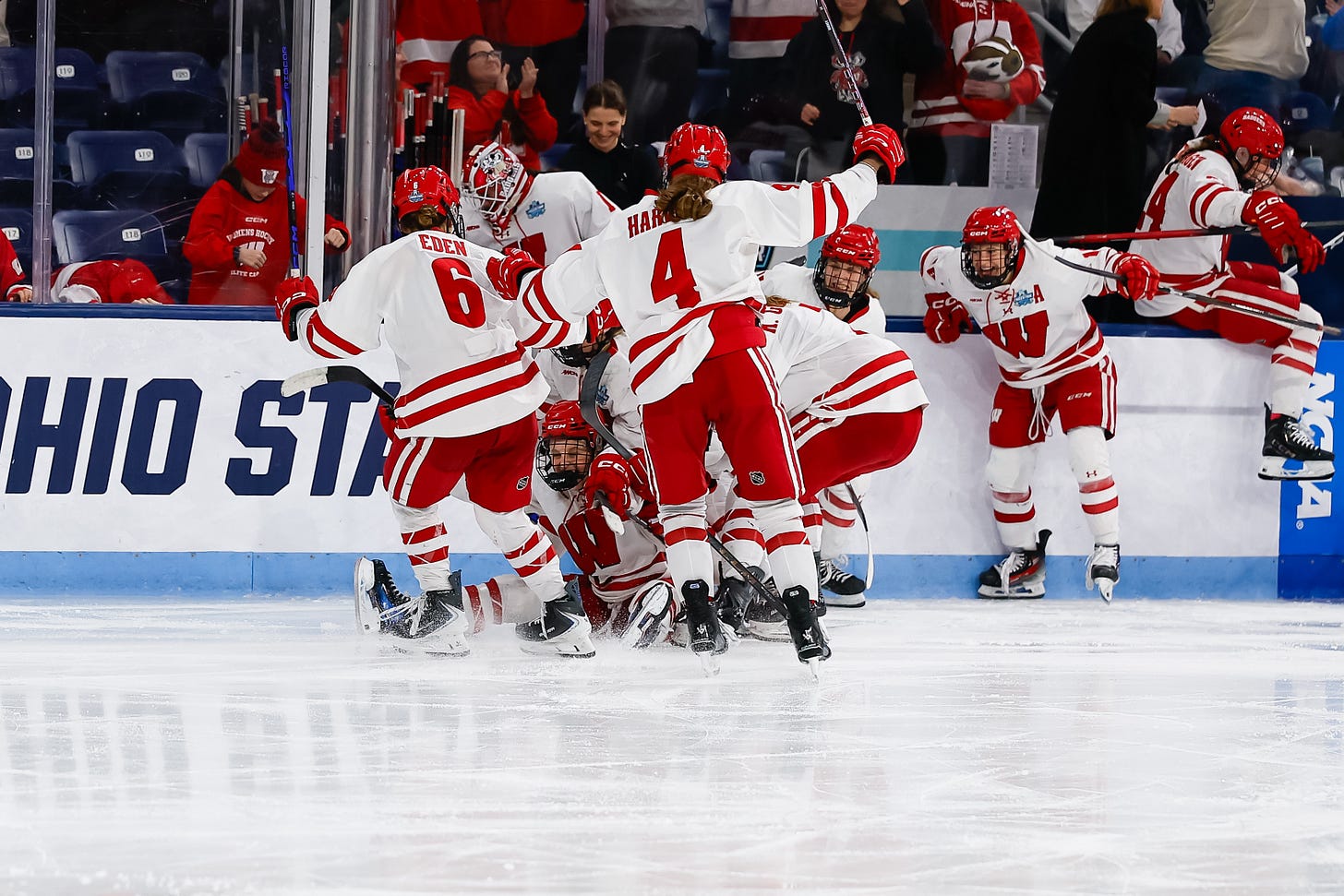 Wisconsin women's hockey players swarming off the bench Wisconsin women's hockey players swarming off the bench