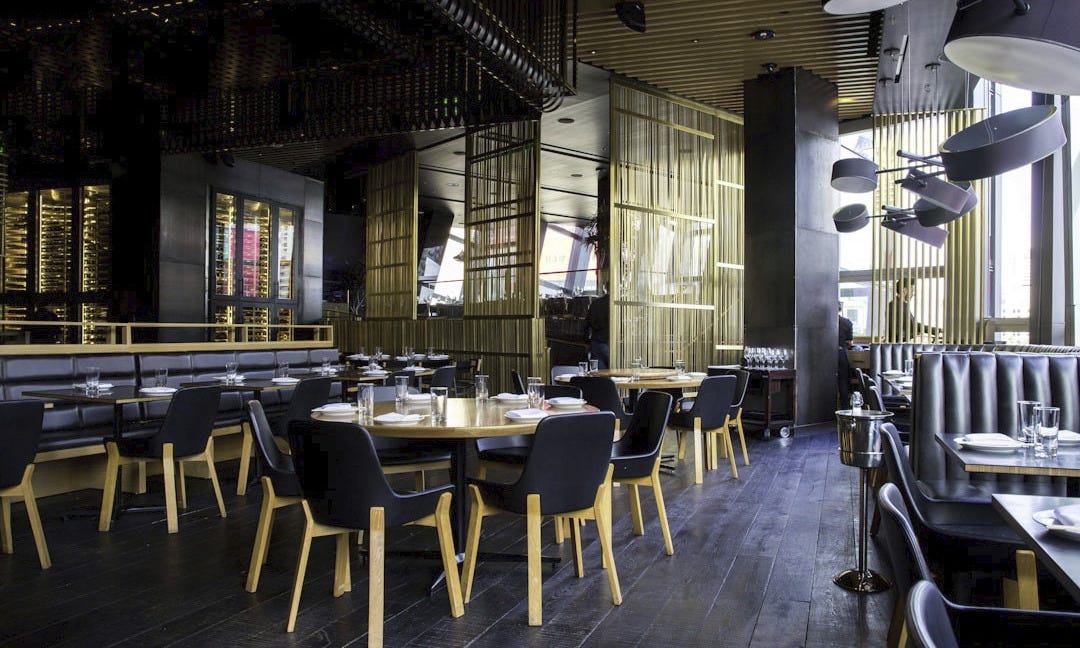 photo of pub set in room during daytime photo of pub set in room during daytime