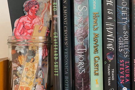 Close-up views of neatly arranged books on a shelf, showcasing a mix of spines and vibrant colours.