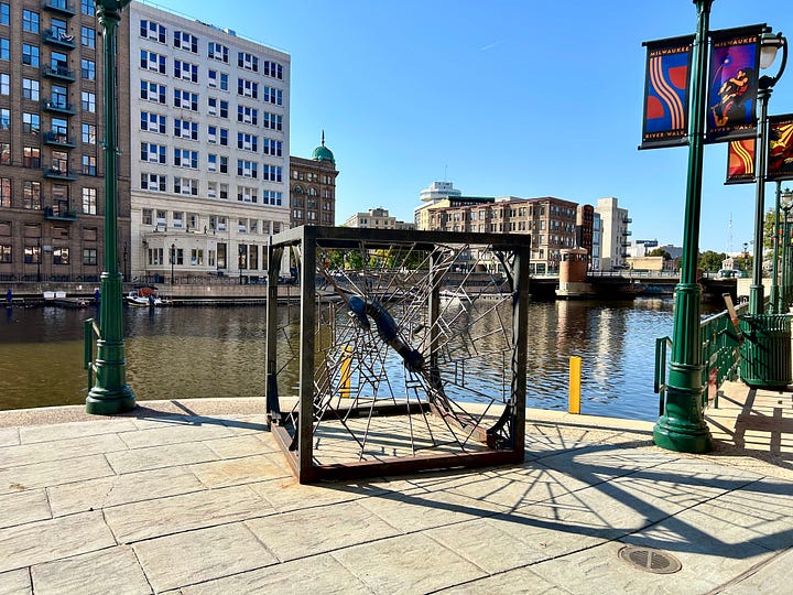 river, walkway, sculptures