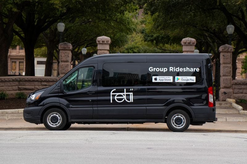 A black van parked on the side of a road

AI-generated content may be incorrect.