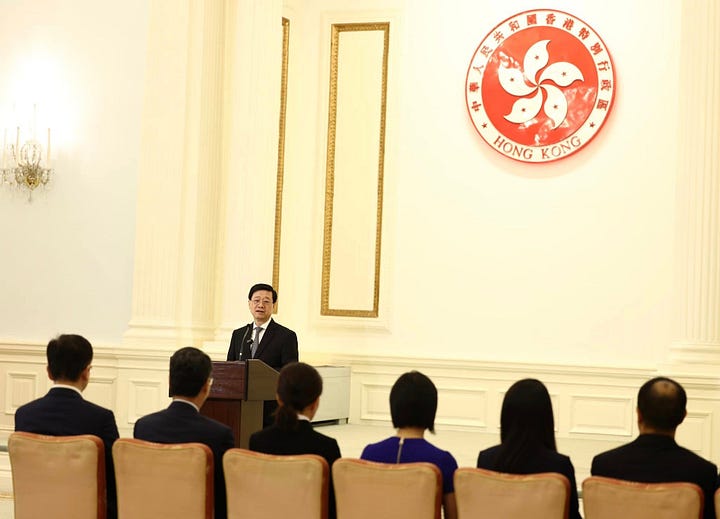 John Lee Ka-chiu and other Hong Kong officials meet the city's taikonaut candidates in June 2023.