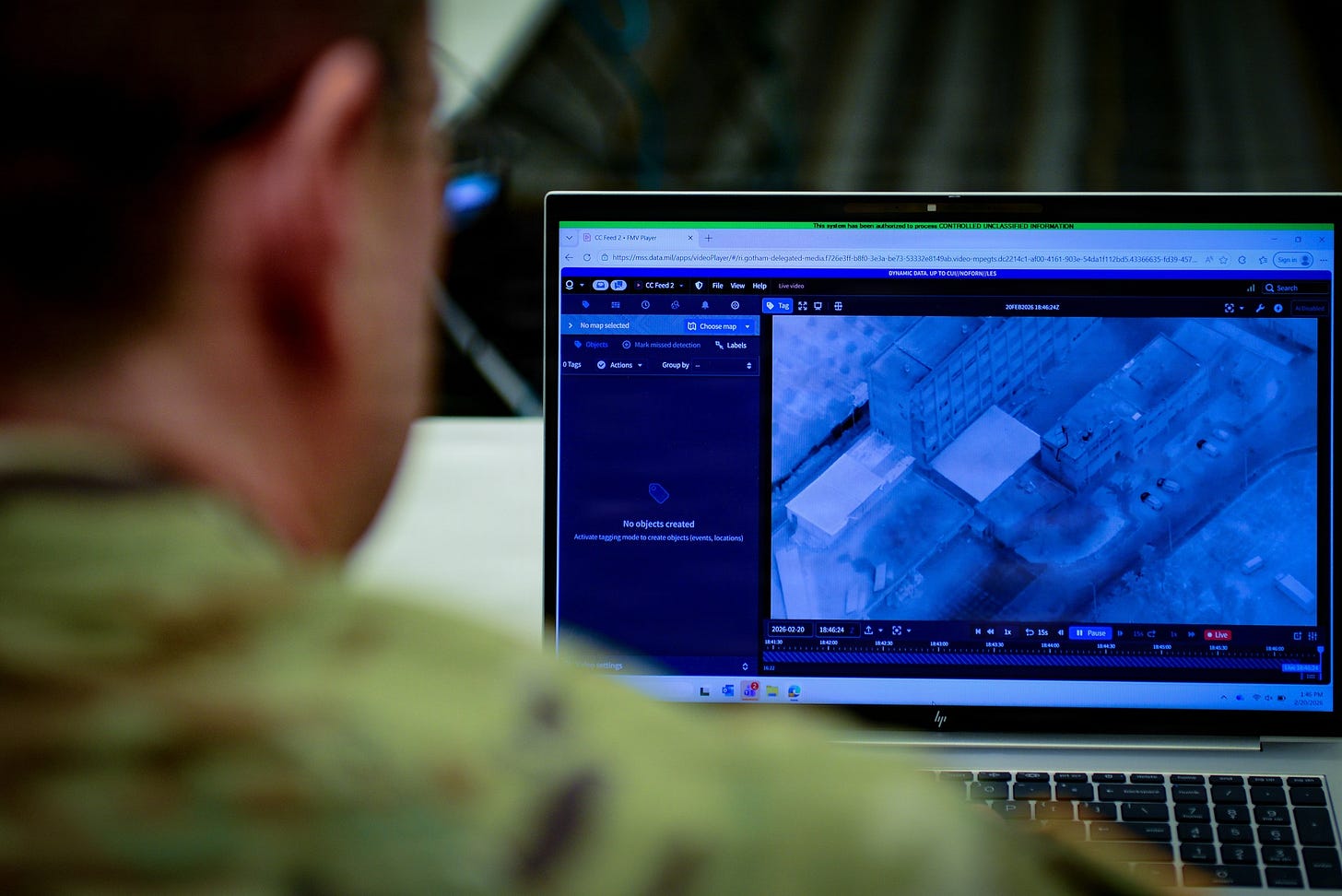 An Army officer studies aerial imagery on a laptop displaying the Maven Smart System during a training class.