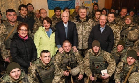 US ambassador to Ukraine Marie Yovanovitch, US senators Amy Klobuchar, John McCain, Ukraine’s president Petro Poroshenko and US senator Lindsey Graham (left to right at center) pose for a photograph with Ukrainian servicemen. US ambassador to Ukraine Marie Yovanovitch, US senators Amy Klobuchar, John McCain, Ukraine’s president Petro Poroshenko and US senator Lindsey Graham (left to right at center) pose for a photograph with Ukrainian servicemen.