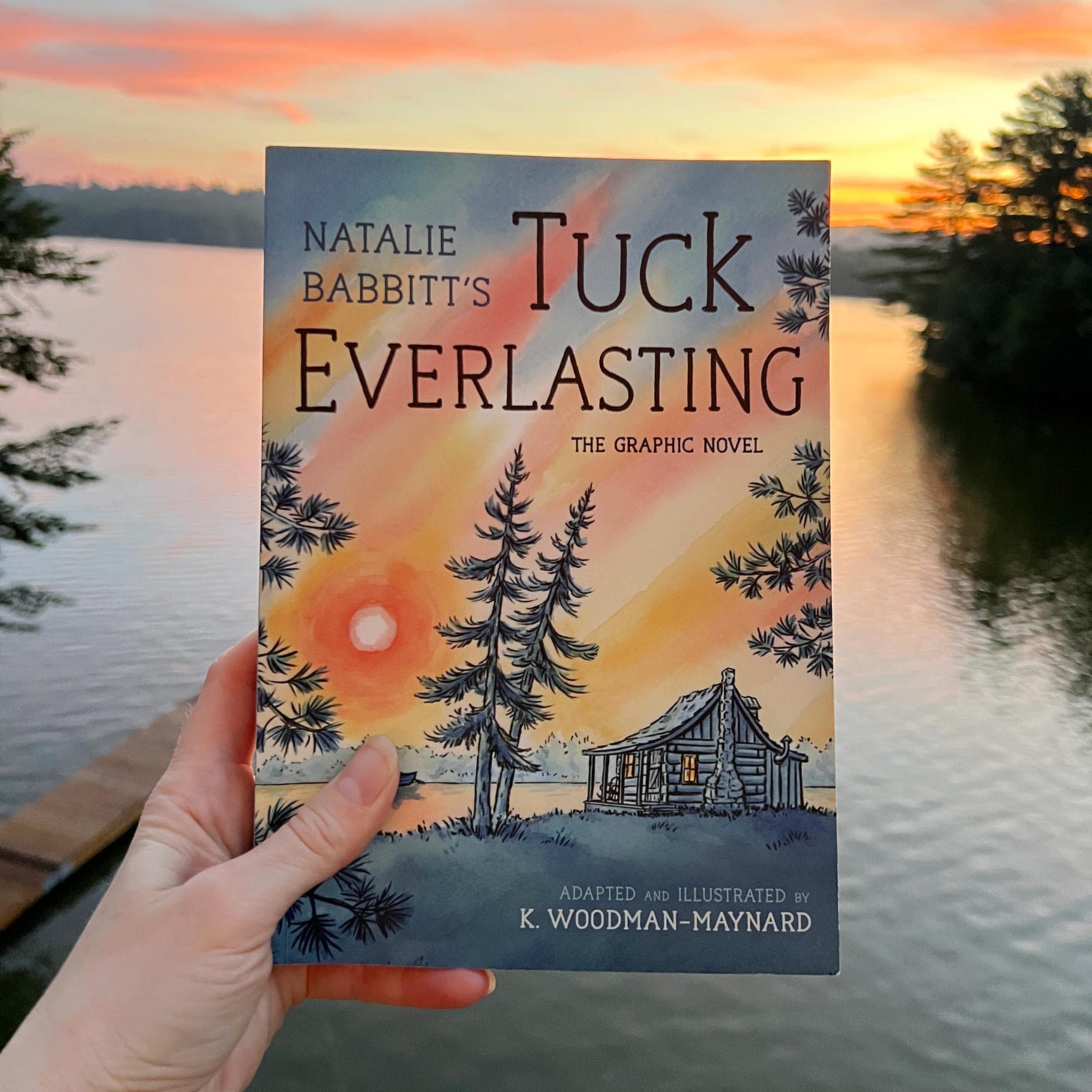 Cover page of the print copy of K. Woodman-Maynard's watercolor graphic novel adaptation of Natalie Babbitt's “Tuck Everlasting.”