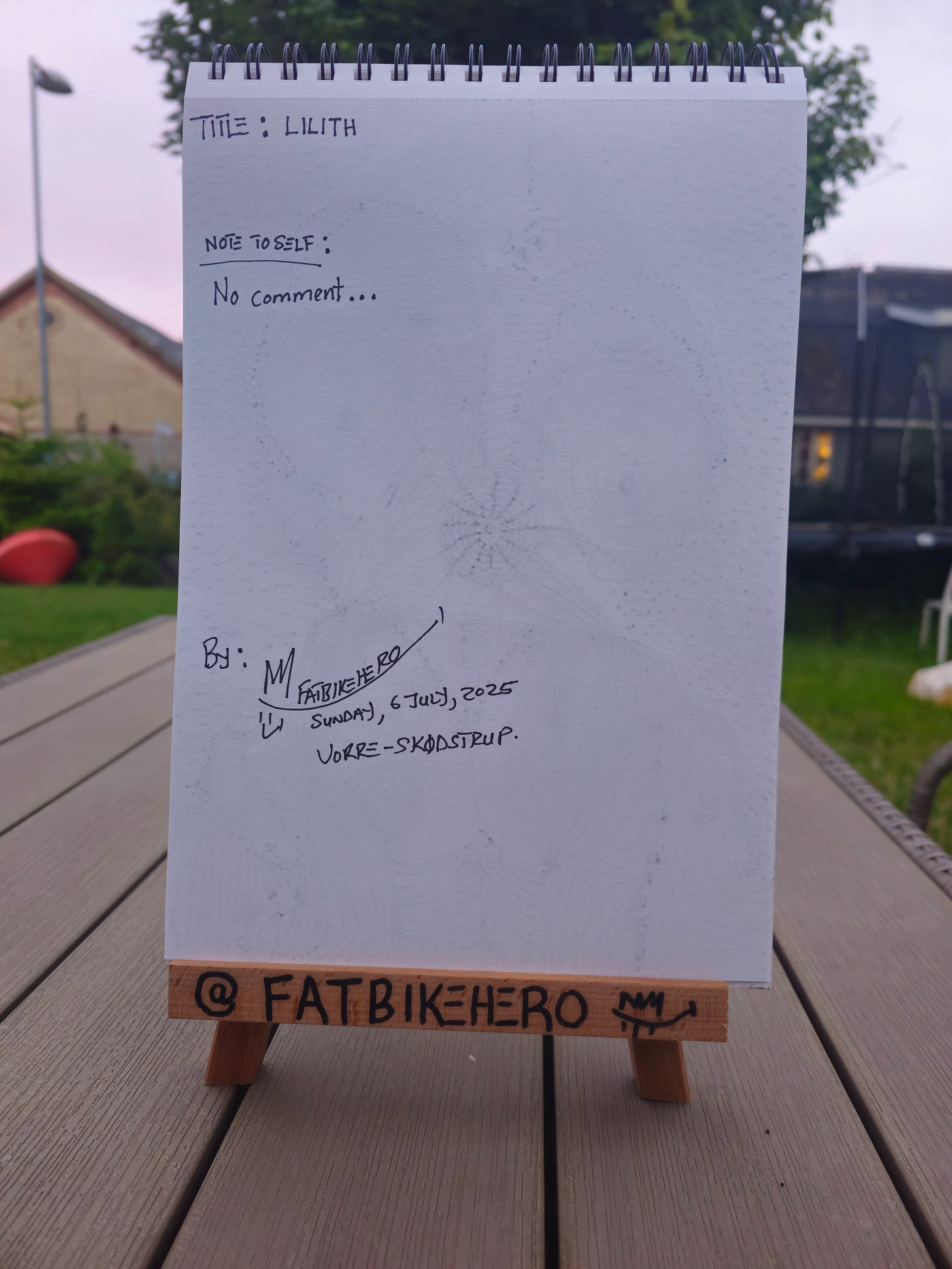 “Hand-drawn ink artwork titled Lilith by FatbikeHero, depicting a mythic female figure composed of dense circular and flowing line patterns, created as a human-made critique of AI aesthetics.”