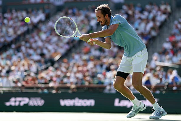 Daniil Medvedev returns against Jannik Sinner of Italy during their Men's Singles Finals match on Day 12 of the BNP Paribas Open at Indian Wells... Daniil Medvedev returns against Jannik Sinner of Italy during their Men's Singles Finals match on Day 12 of the BNP Paribas Open at Indian Wells...