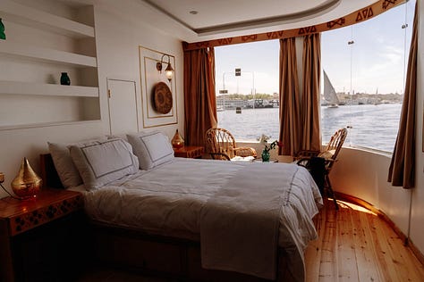 3 photos: 1 of a golden sarcophagus in the Egyptian museum, 1 of a beautiful bedroom on a nile sailboat where you can see the water through the window, and 1 of Anela standing smiling in the foreground with the pyramids in the background.