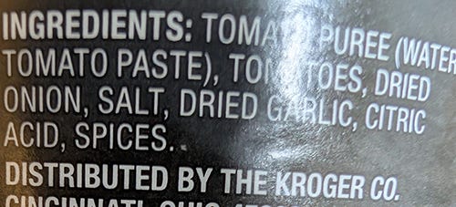 Ingredient label from Kroger spaghetti sauce showing Tomatoes, Tomato sauce, dried onion, salt, dried garlic, citric acid, and spices